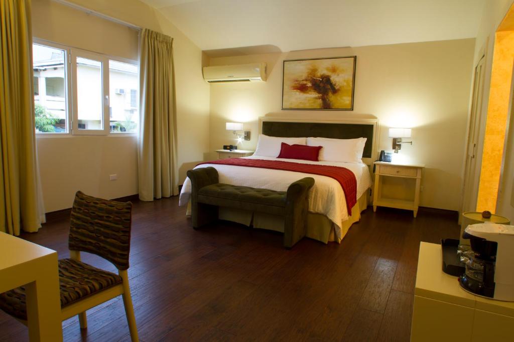 Postel nebo postele na pokoji v ubytování Isabella Boutique Hotel