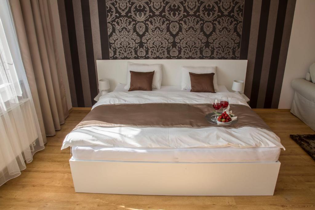 Postel nebo postele na pokoji v ubytování Villa Grande - Apartmány