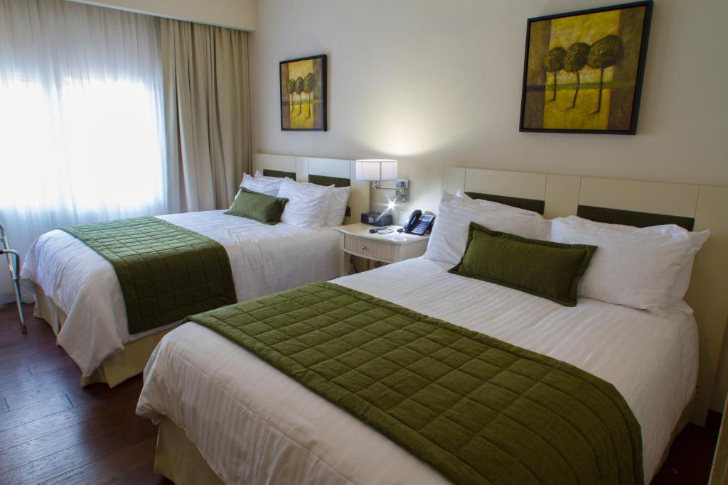Postel nebo postele na pokoji v ubytování Isabella Boutique Hotel