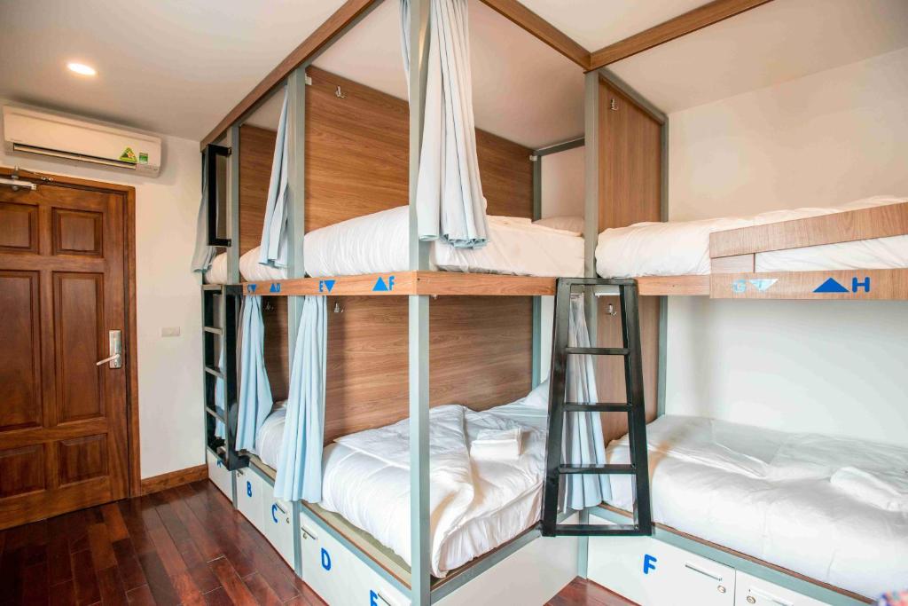Postel nebo postele na pokoji v ubytování Nexy Hostel