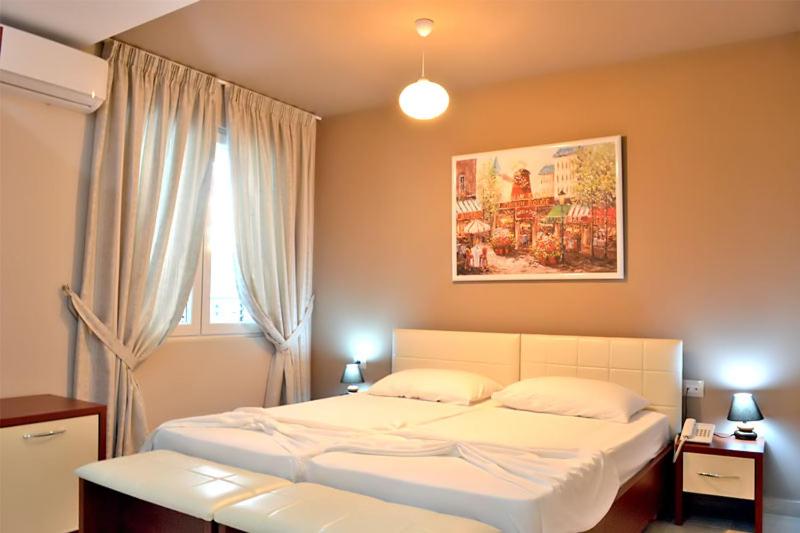 Postel nebo postele na pokoji v ubytování Vila Ada Hotel
