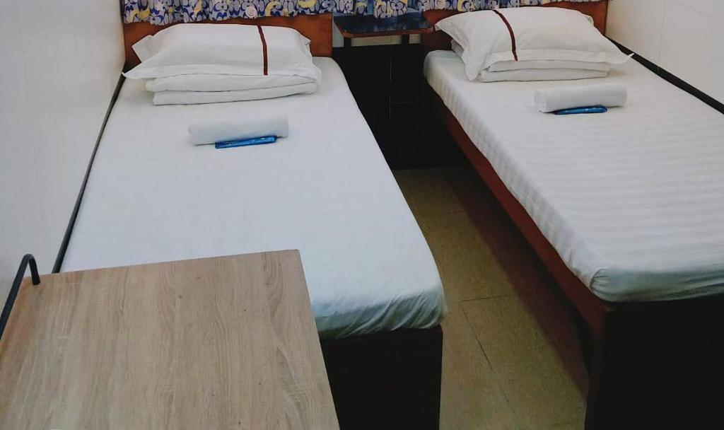 Ένα ή περισσότερα κρεβάτια σε δωμάτιο στο Roca Guesthouse 樂家賓館