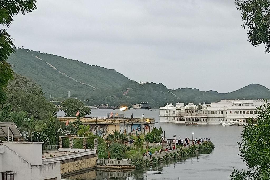 a view of a body of water with buildings at Lake Pichola Hibiscus Hotel in Udaipur