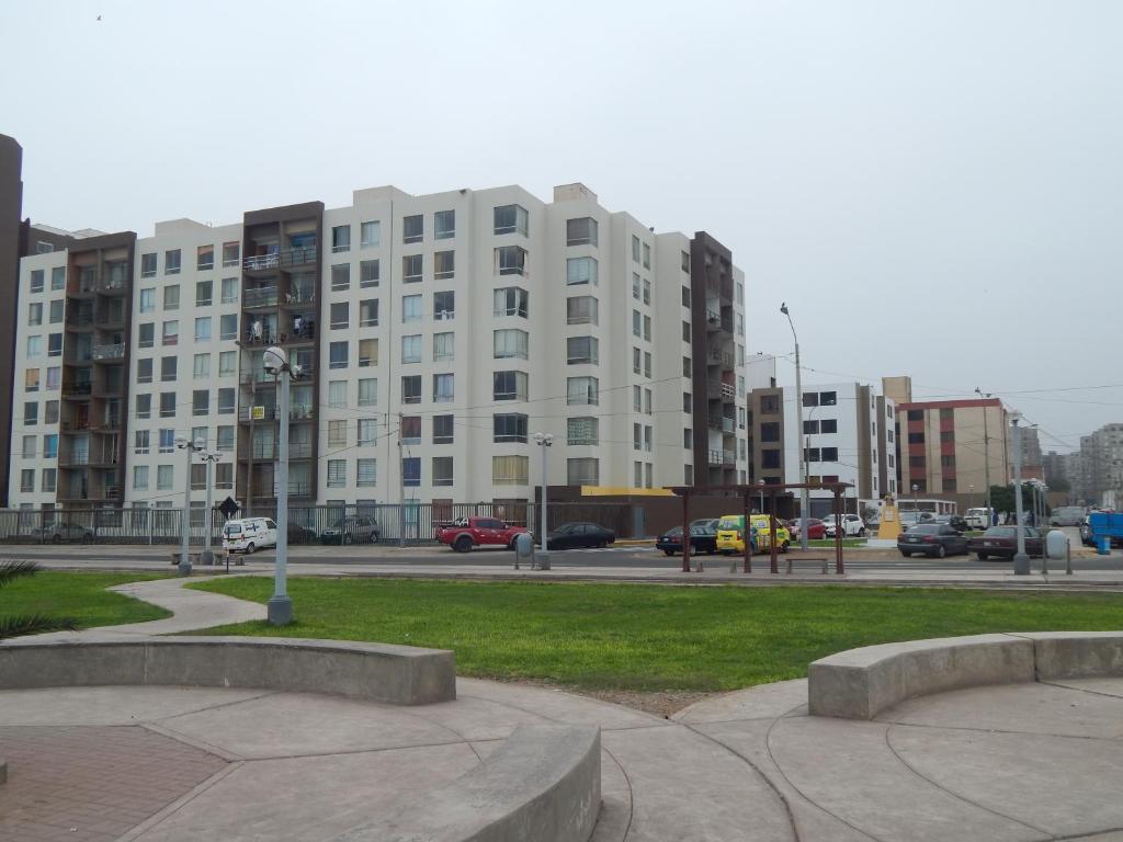 a large white building in the middle of a city at Brisas Del Pacifico in Lima