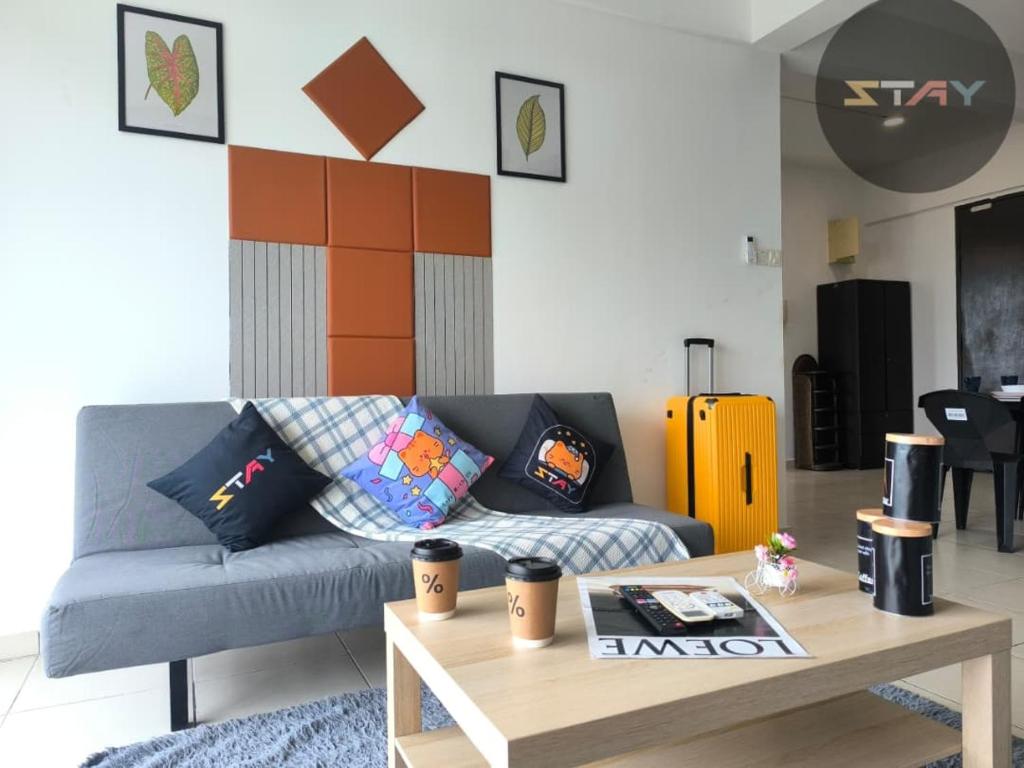 a living room with a couch and a coffee table at The Garden 2BR 4Pax Cozy Stylish Netflix BySTAY in Skudai