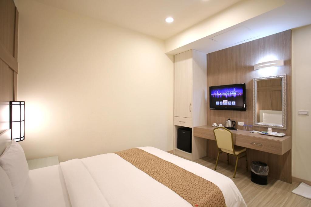 Postel nebo postele na pokoji v ubytování Chengdian Hotel