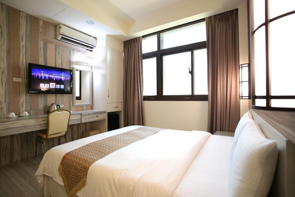 Postel nebo postele na pokoji v ubytování Chengdian Hotel