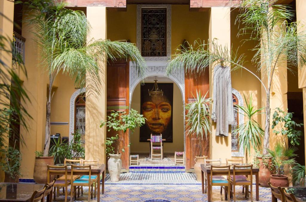 a building with a large head on the wall at Riyad Al Atik in Fès