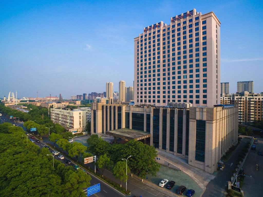 an aerial view of a large building in a city at Happiness Hotel in Changzhou