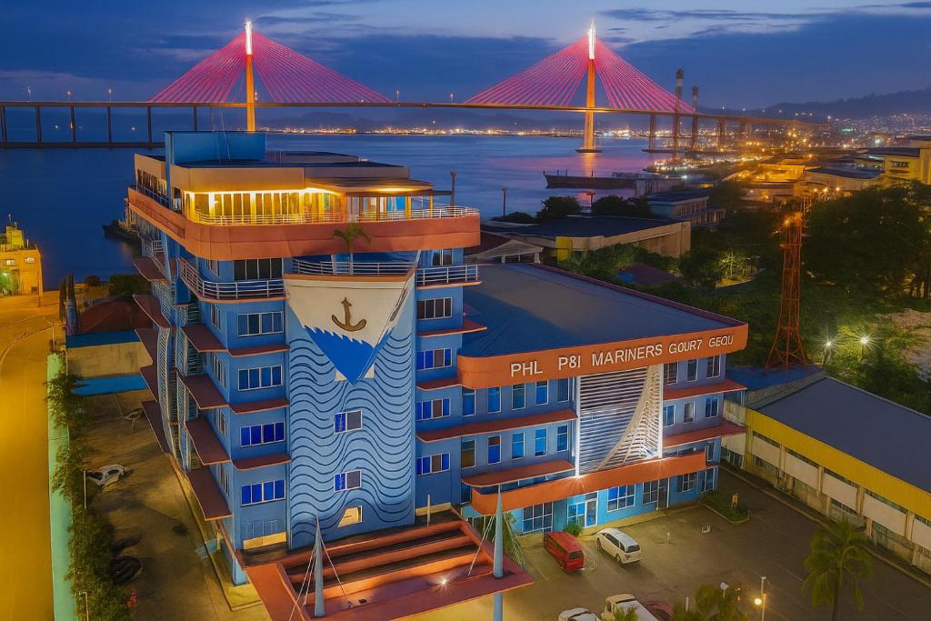 a rendering of a hotel with a bridge in the background at Mariners Court Hotel Cebu in Cebu City