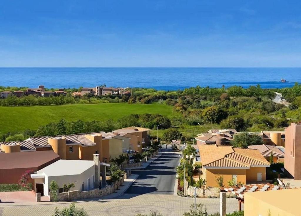 arial view of a residential neighborhood with the ocean at Stay and Nest Casa Nola Elegant Modern Bungalow, Pool & Sea Location, Paphos in Chlorakas