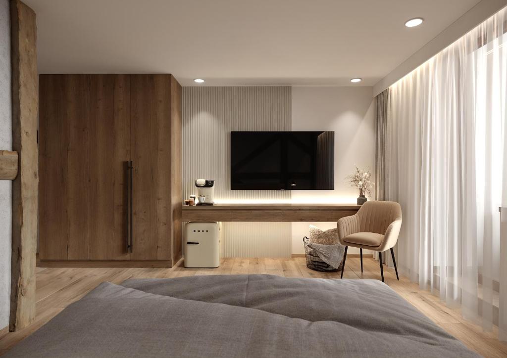 Μια τηλεόραση ή/και κέντρο ψυχαγωγίας στο Chamois Apartments