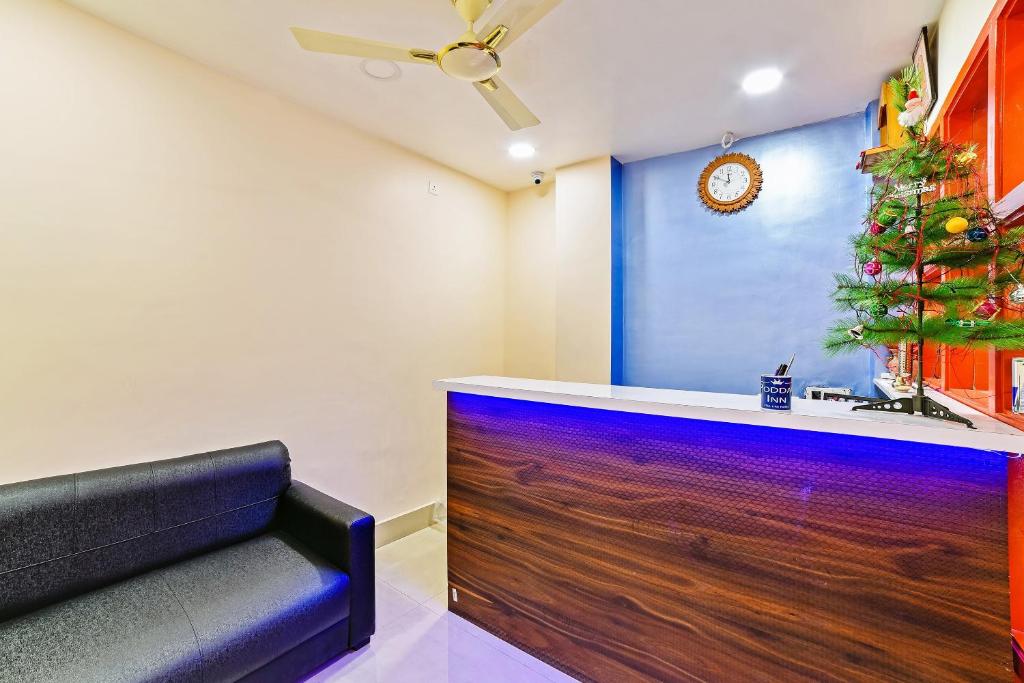 a bar with a christmas tree on the wall at Hotel O Poddar Inn in Dispur