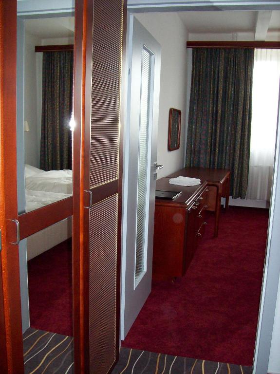 Postel nebo postele na pokoji v ubytování Hotel S-centrum Děčín