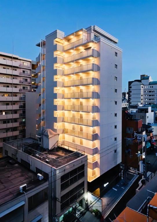 a view of a tall building in a city at PG Kuromon in Osaka