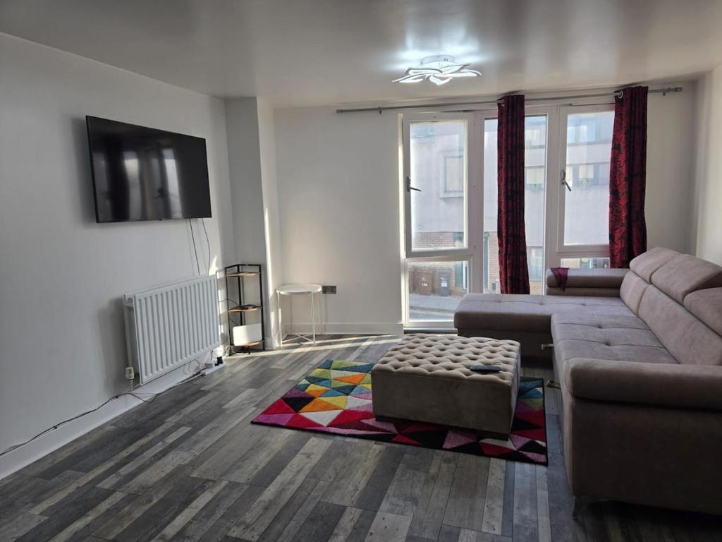 a living room with a couch and a rug at One bedroom flat in Barking