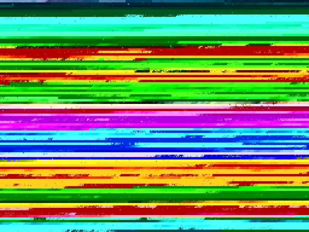 una pila de libros de colores del arco iris en Holiday Home Josef - 950m from the sea by Interhome, en Fanø