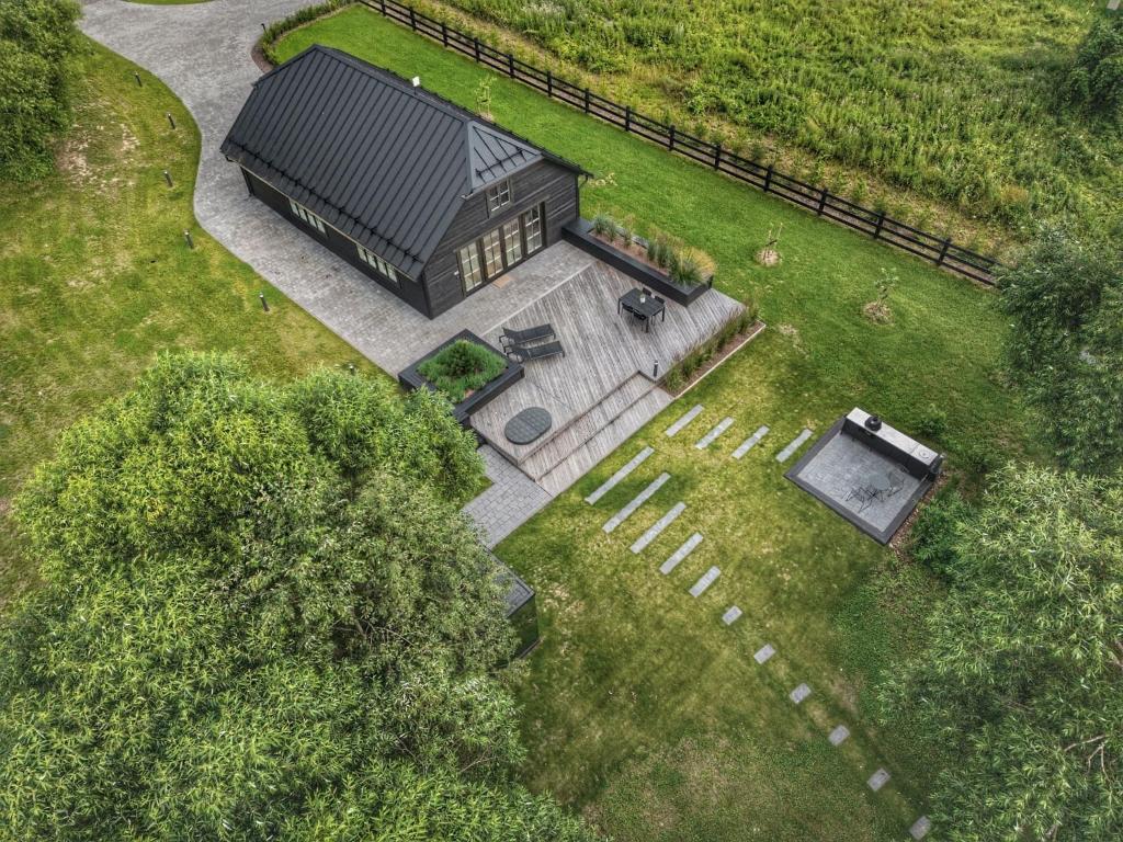 an overhead view of a building in a yard at Watermill Resort in Leebiku