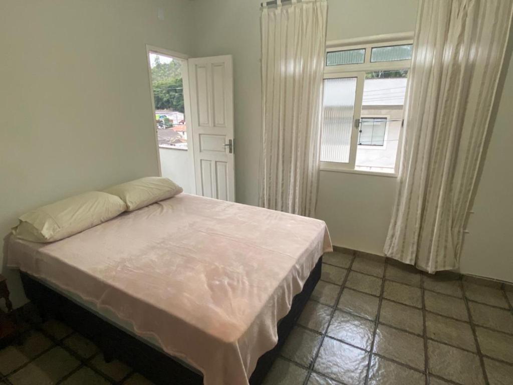 Postel nebo postele na pokoji v ubytování Casa Joaninha Biasutti