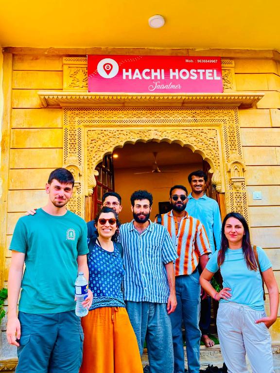 a group of people standing in front of a building at Hachi Hostel Jaisalmer in Jaisalmer