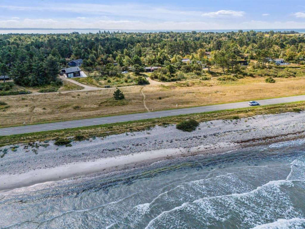 an aerial view of a beach and a road at Holiday Home Kaj - 75m from the sea by Interhome in Tjørneholm