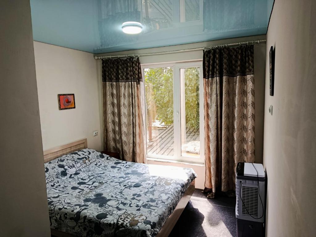 Ένα ή περισσότερα κρεβάτια σε δωμάτιο στο Guest House "Asia"