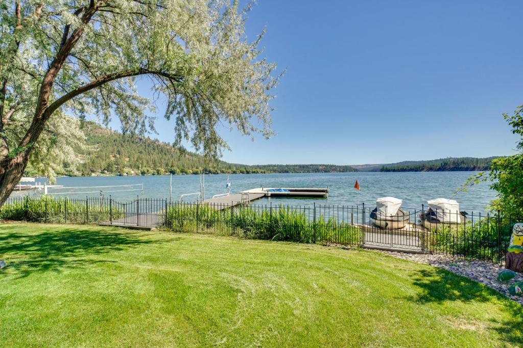 a view of a lake with boats in the water at Waterfront Deck with Fire Pit Lake Spokane Gem! in Deer Park