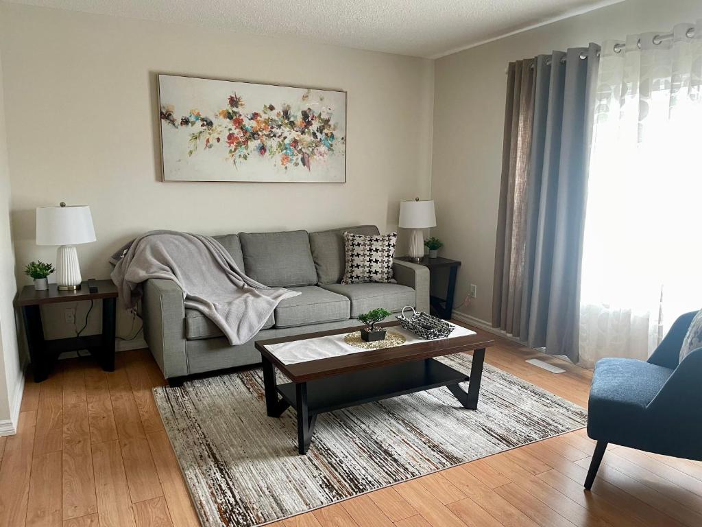 a living room with a couch and a coffee table at Home beside WEM in Edmonton