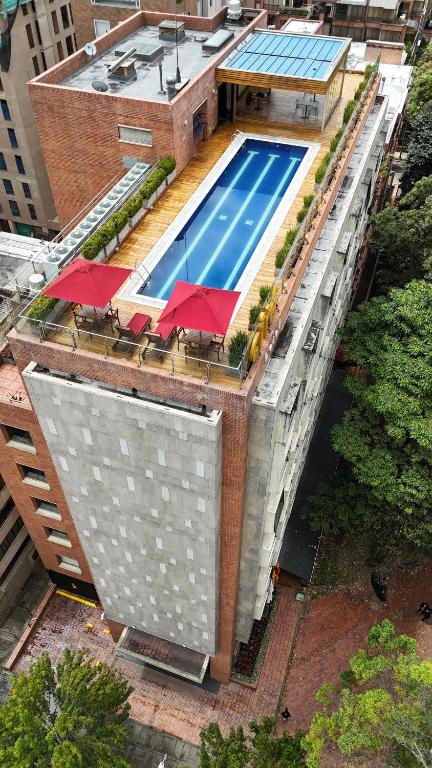 an overhead view of a swimming pool on top of a building at Cité Hotel in Bogotá