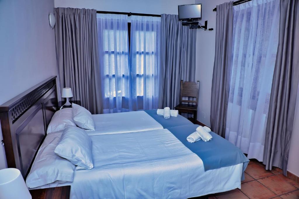 Giường trong phòng chung tại Ordaola