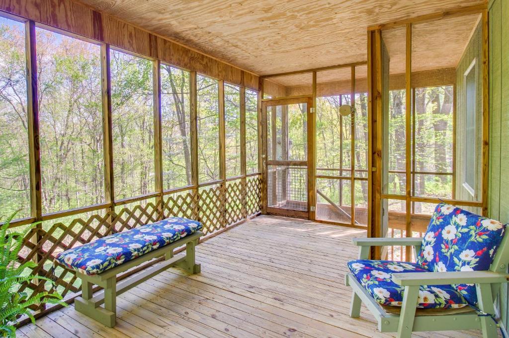 a screened in porch with two chairs and windows at Shenandoah National Park Cabin with Patio! in McGaheysville