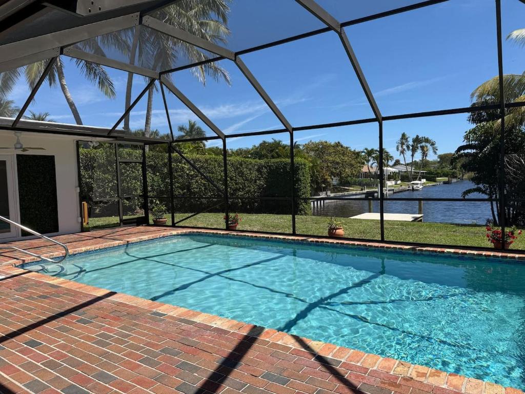 a swimming pool with a view of the water at Serenety Shores in West Palm Beach
