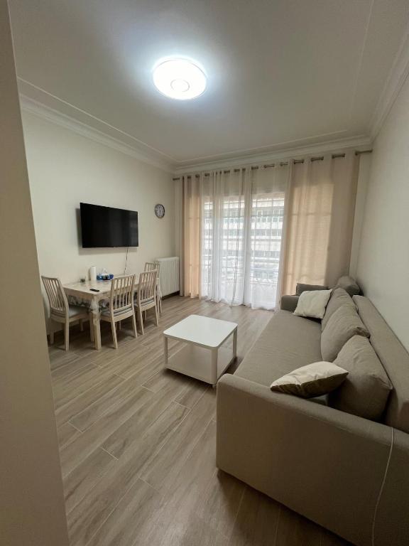 a living room with a couch and a table at Superbe appart près de la mer in Nice