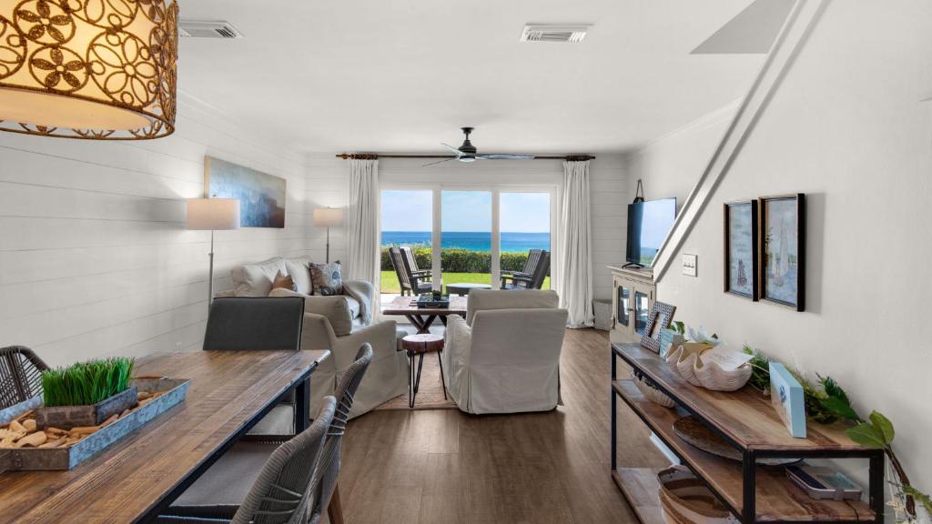 a living room with a table and a dining room at Seashadows Townhomes 4 in Seacrest