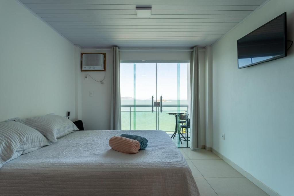 Giường trong phòng chung tại Estúdio 6 - Vista Incrivel em Espaço Aconchegante