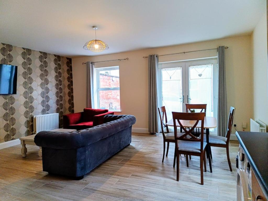 a living room with a couch and a table at City Centre C Apartment, Parking, Ground Floor in Belfast