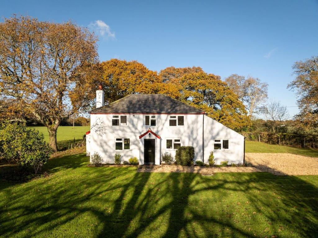 a white barn with a red x on it at Hobbs Cottage in Hinton