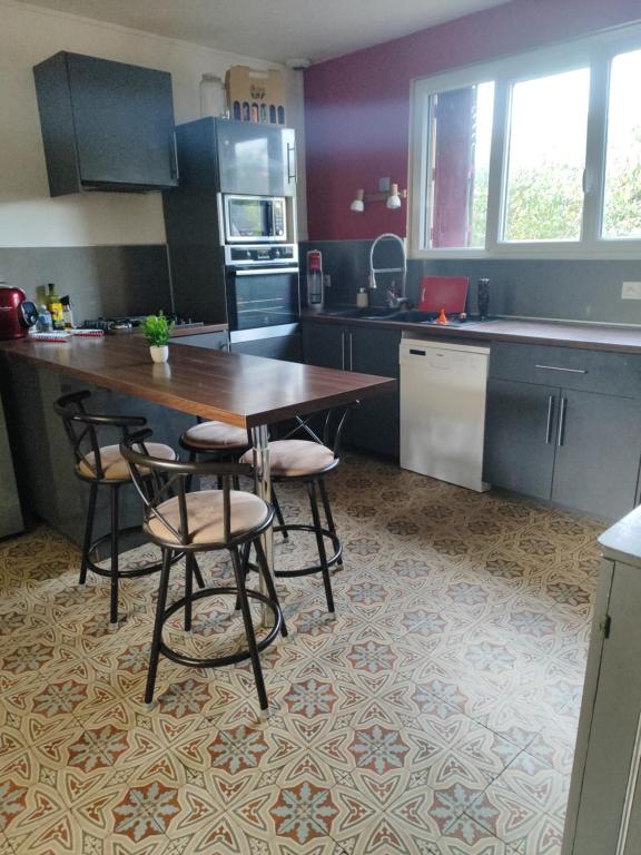 Køkken eller tekøkken på Chambre a 5 min de Center Parc bois aux daims