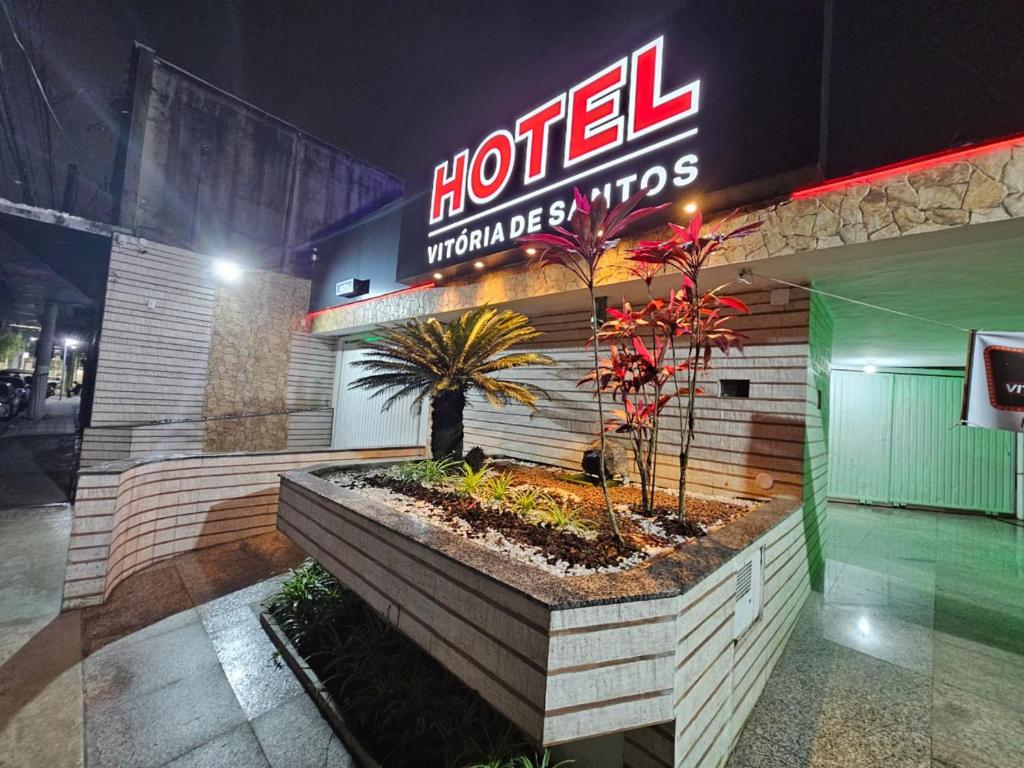 a hotel with a sign on the front of it at Hotel Vitória de Santos in Santos