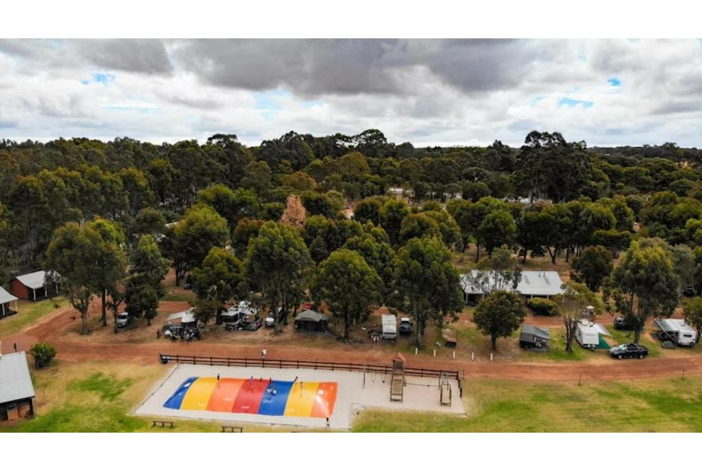 an aerial view of a park with a pool and trees at Discovery Parks Margaret River in Cowaramup