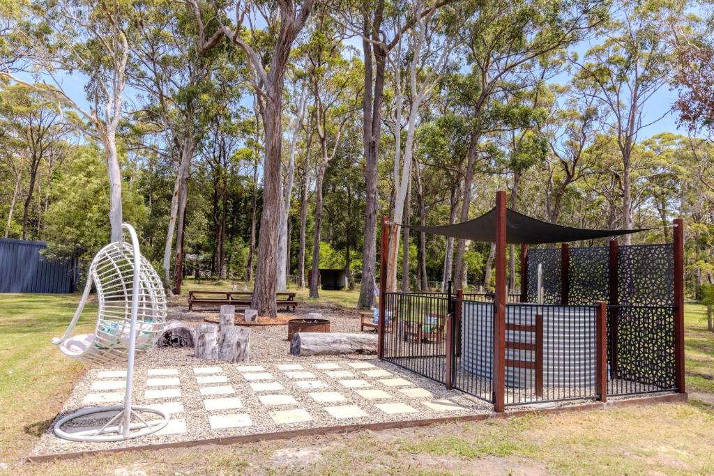 a park with a gate and a swing at Home among the Gum Trees" - 10 mins to Vincentia in Worrowing Heights
