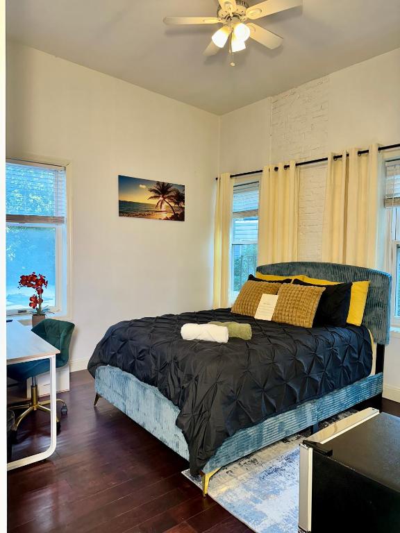 a bedroom with a bed and a ceiling fan at BP STAYS - Hotel-Style, No Host, Professionally Managed ID302 in Jersey City