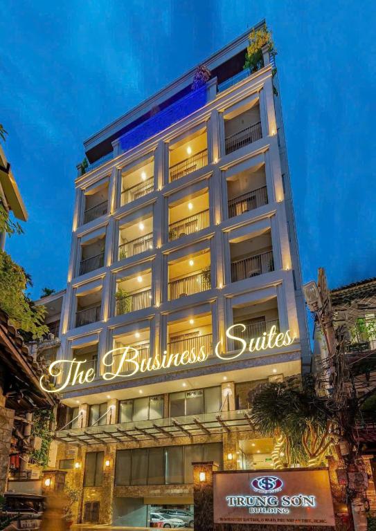 a building with a sign that reads the business suites at DHTS Business Hotel & Apartment in Ho Chi Minh City