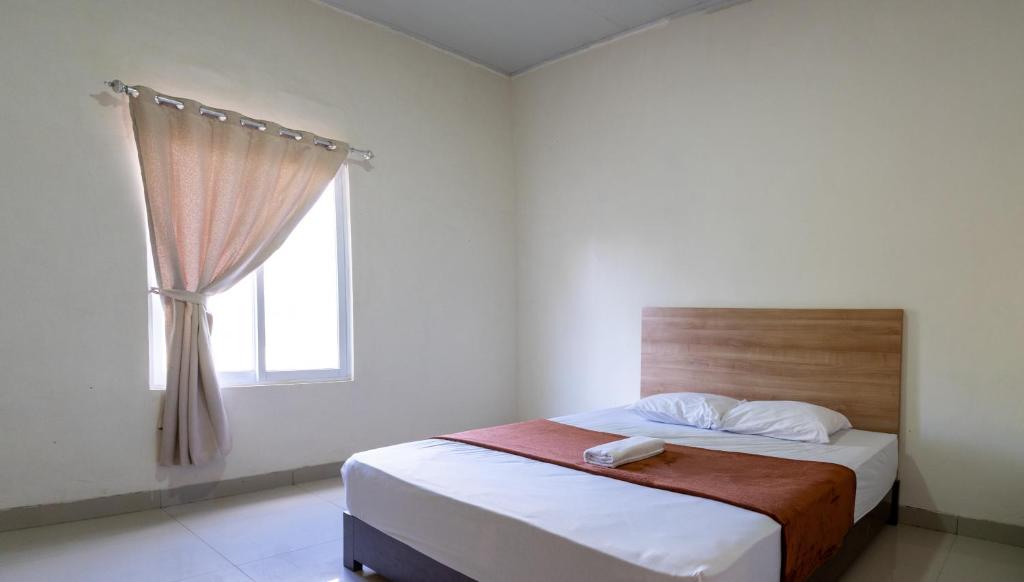 Кровать или кровати в номере Grand Soe Hotel