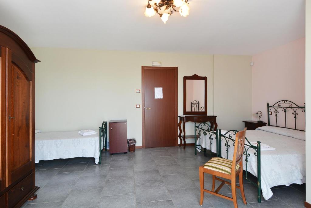 Postel nebo postele na pokoji v ubytování B&B La Castellana