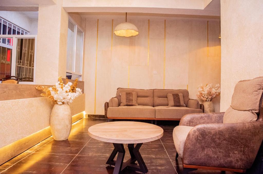 a living room with a couch and a table at South Tetu B&B-Nairobi CBD in Nairobi