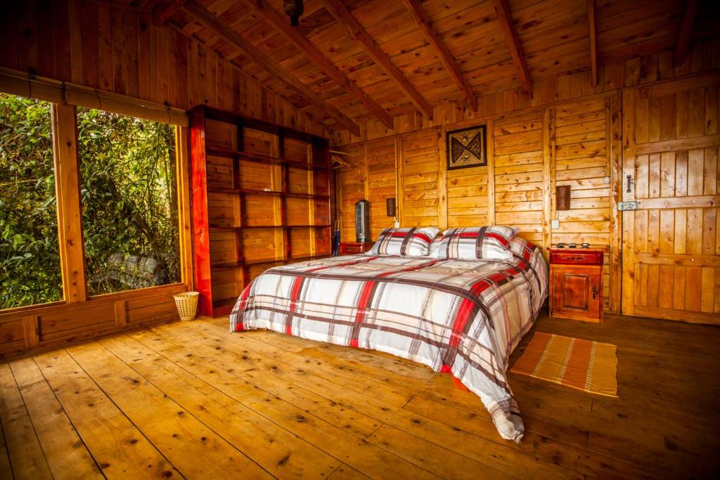 Postel nebo postele na pokoji v ubytování Paraíso Quetzal Lodge