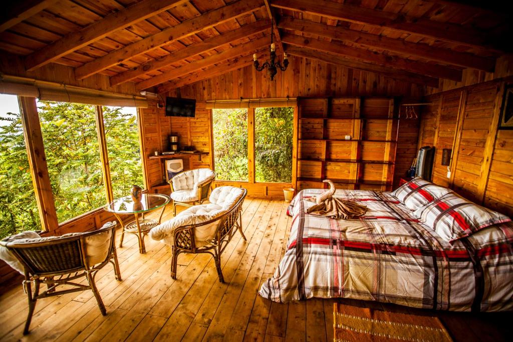 Postel nebo postele na pokoji v ubytování Paraíso Quetzal Lodge