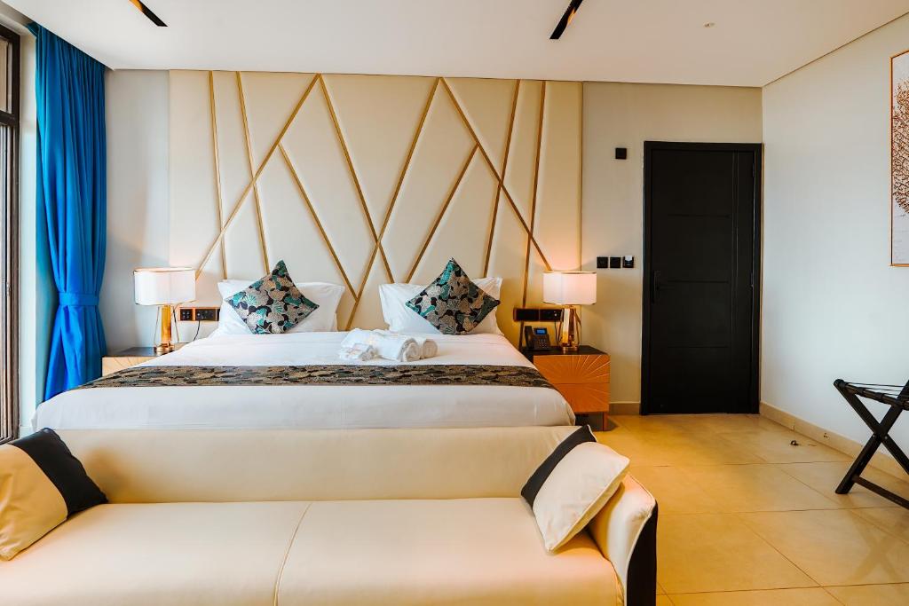 Postel nebo postele na pokoji v ubytování Hotel Noesis