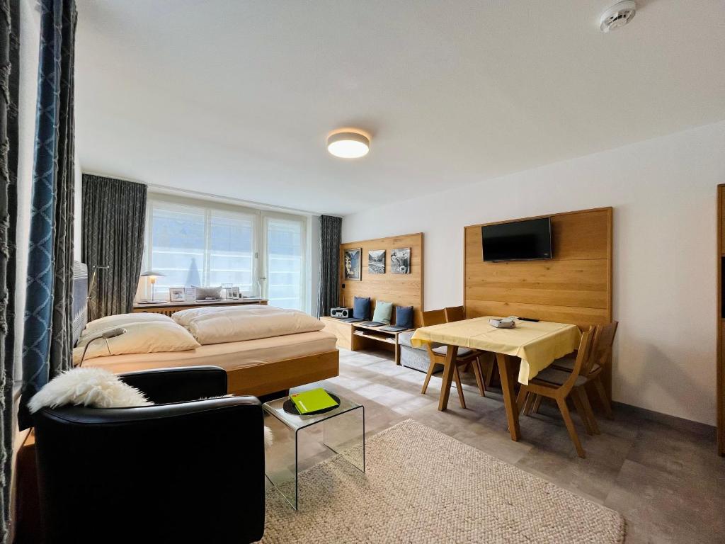 Ένα ή περισσότερα κρεβάτια σε δωμάτιο στο Hüttenzauber, Montana Haus